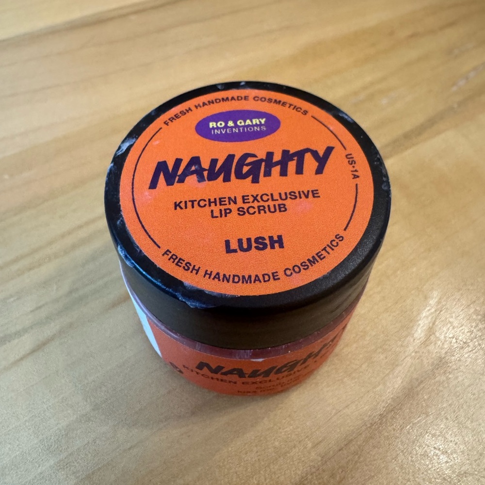 Lush Naughty Lip Scrub in Bold Orange
